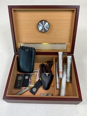 Lot 6 - A rectangular humidor, three cigars in tubes,...
