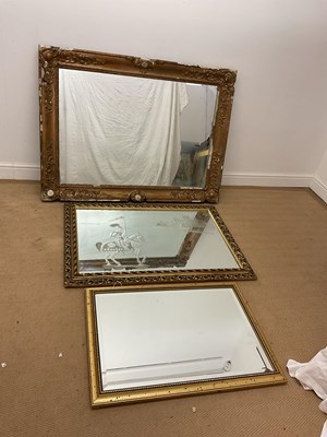 Lot 748 - Three gilt framed decorative wall mirrors,...
