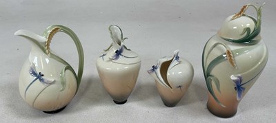 Lot 206 - FRANZ PORCELAIN; a pitcher, two vases, and a...