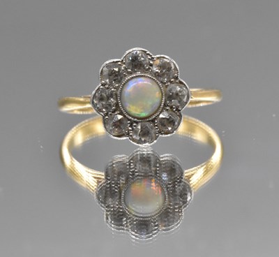 Lot 527 - A yellow metal opal and diamond ring, the...
