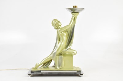 Lot 1716 - An Art Deco green painted plaster figural lamp,...