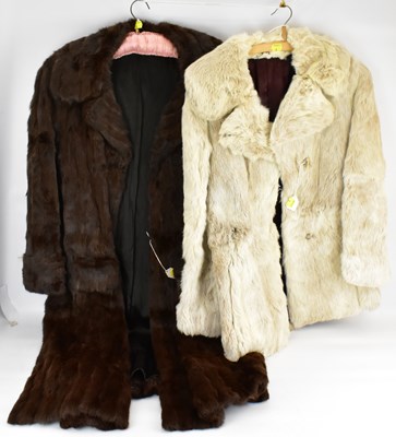 Lot 367 - A short white fur coat, length 75cm and with a...