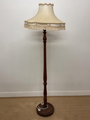 Lot 665 - A mahogany floor lamp with damask fabric shade,...