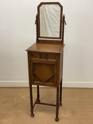 Lot 780 - An oak shaving stand with bevelled mirror,...