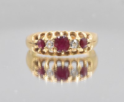 Lot 541 - An 18ct yellow gold diamond and ruby graduated...