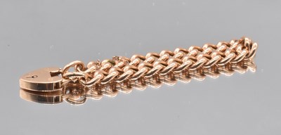 Lot 536 - A 15ct yellow gold curb link bracelet with...
