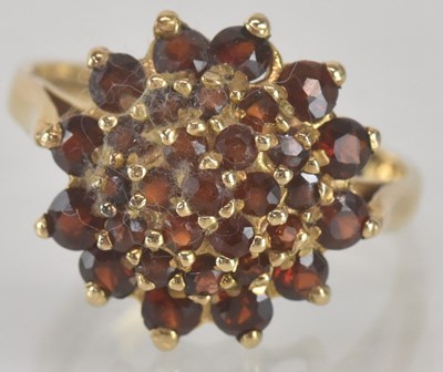 Lot 1295 - A 9ct gold garnet cluster ring, size P, approx...