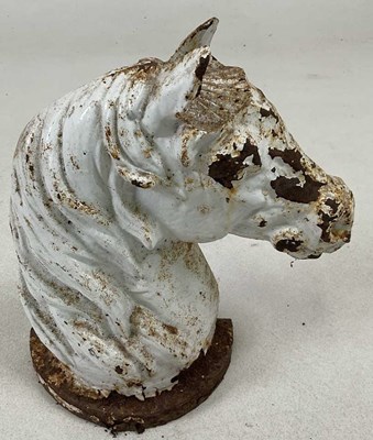 Lot 180 - A cast iron horse head door stop, with white...
