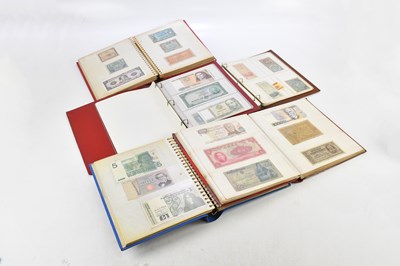 Lot 1450 - Five albums of British and foreign banknotes...