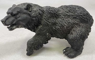 Lot 174 - A cast hollow metal work grizzly bear, 20 x 40cm.