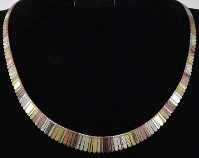 Lot 1385 - A 9ct gold three colour graduated drop link...