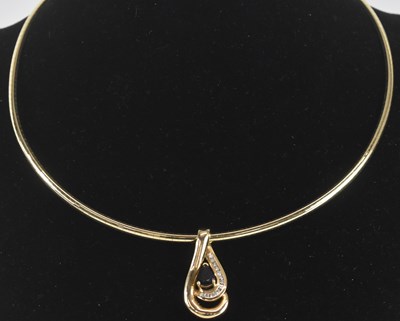 Lot 1388 - A 14K yellow gold necklace of semi-rigid form,...