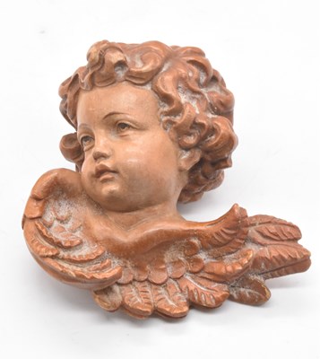 Lot 67 - A small well detailed limewood carving of a...
