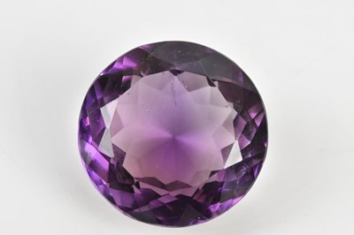 Lot 411 - A round brilliant cut loose amethyst, approx...