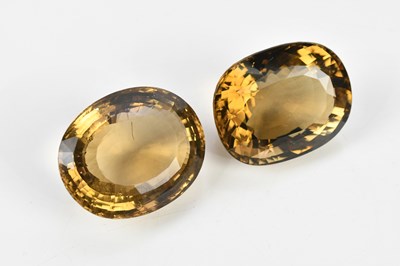 Lot 413 - Two large oval cut loose citrines (2).