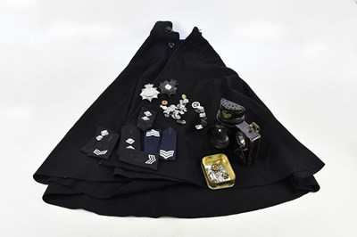 Lot 2455 - A policeman's cape, badge, torches and...
