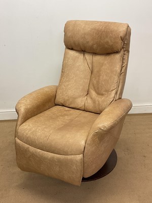 Lot 753 - A 1970s faux leather reclining swivel chair on...