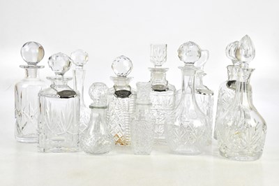 Lot 1689 - A collection of eleven cut glass decanters,...