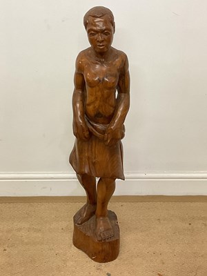 Lot 152 - A carved hardwood figure of an African man,...
