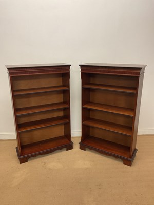 Lot 790 - A pair of reproduction mahogany open bookcases,...