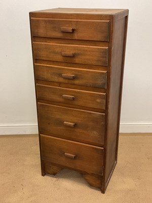 Lot 773 - A narrow wooden chest of six graduated drawers,...