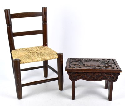 Lot 1707 - A carved oak stool