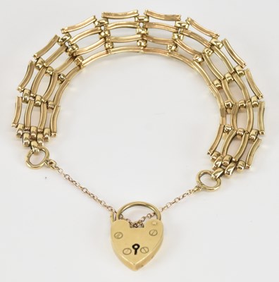 Lot 1581 - A 9ct gold four-bar gate link bracelet, united...