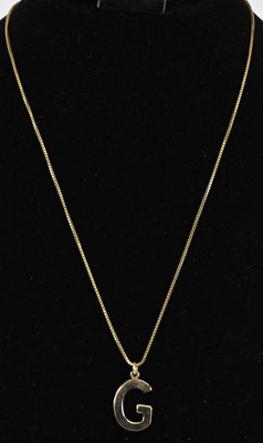 Lot 1449 - A 9ct gold necklace, length 44cm, suspending a...