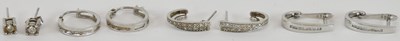 Lot 1489 - Four pairs of 9ct white gold earrings,...