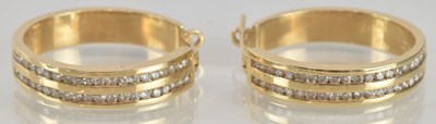 Lot 1478 - A pair of 14K yellow gold heavy and wide hoop...