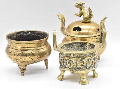 Lot 44 - Three 19th century Chinese brass vessels...