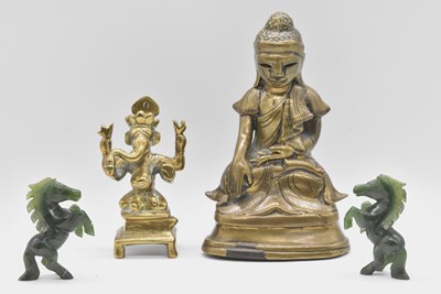 Lot 55 - A 19th century Sino-Tibetan brass Buddha,...