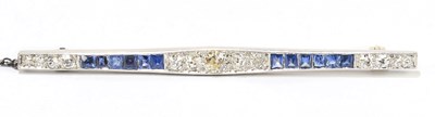 Lot 1421 - An Art Deco white metal diamond and sapphire...