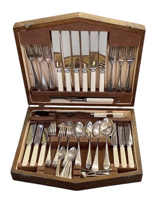 Lot 1004 - A 1920s oak cased six setting canteen of...
