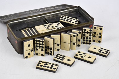 Lot 2375 - A part set of Victorian bone and ebony dominoes.