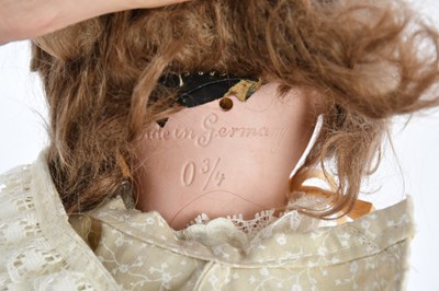 Lot 2445 - A German bisque headed doll with articulated...