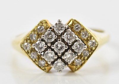 Lot 84 - A 14ct yellow gold diamond stepped lozenge...