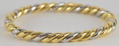 Lot 1572 - An 18ct yellow and white gold twist type snap...