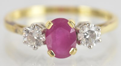 Lot 1248 - A yellow metal ruby and diamond set three...