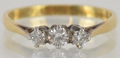 Lot 1249 - An 18ct yellow gold diamond set three stone...