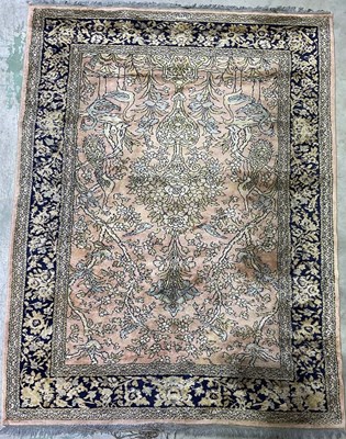 Lot 680 - A Persian rug, with urn, floral and bird...