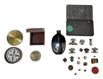 Lot 409 - A collection of five military cap badges, also...