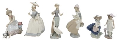 Lot 646 - LLADRÓ; three porcelain figures of young girls,...