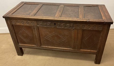 Lot 703 - An 18th century oak coffer, with carved front...