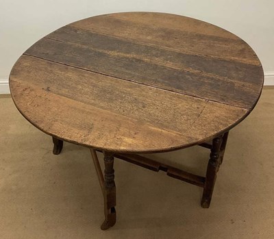 Lot 761 - An 18th century oak drop-leaf table, extended...