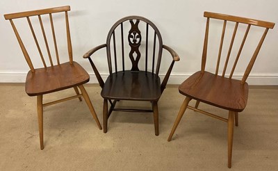 Lot 694 - ERCOL; a pair of elm and beech stickback...