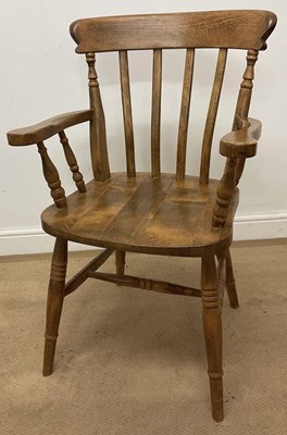 Lot 744 - A light oak Windsor stick back armchair,...