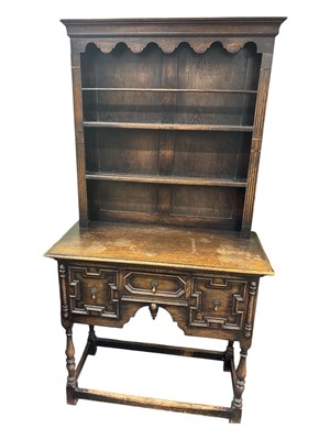 Lot 68 - A 1920s oak Jacobean style dresser, with...