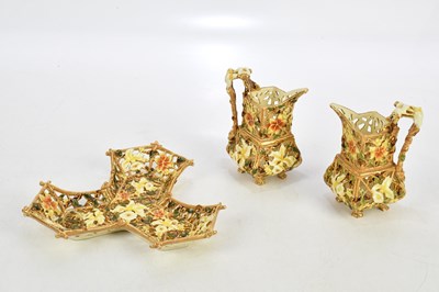 Lot 1696 - ZSOLNAY PECS; a pair of pierced and floral...
