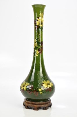 Lot 1597 - BURMANTOFTS; a faience green ground floral...